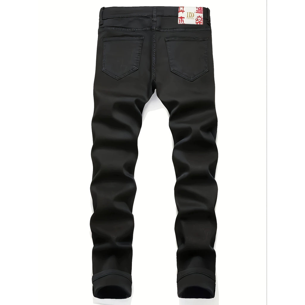 New European and American model: black, dirty, print, ripped, trendy men’s jeans.