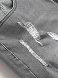 Men's gray skinny jeans with large rips, featuring a unique distressed design that fits the body shape perfectly, making it easy