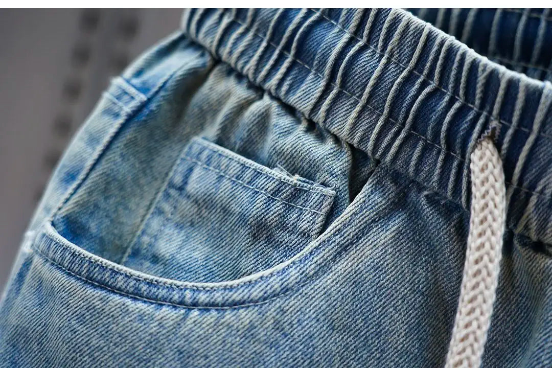 Men's distressed ripped drawstring and cuffed jeans with rivet embellishments high-street slim-fit trousers brand men clothing