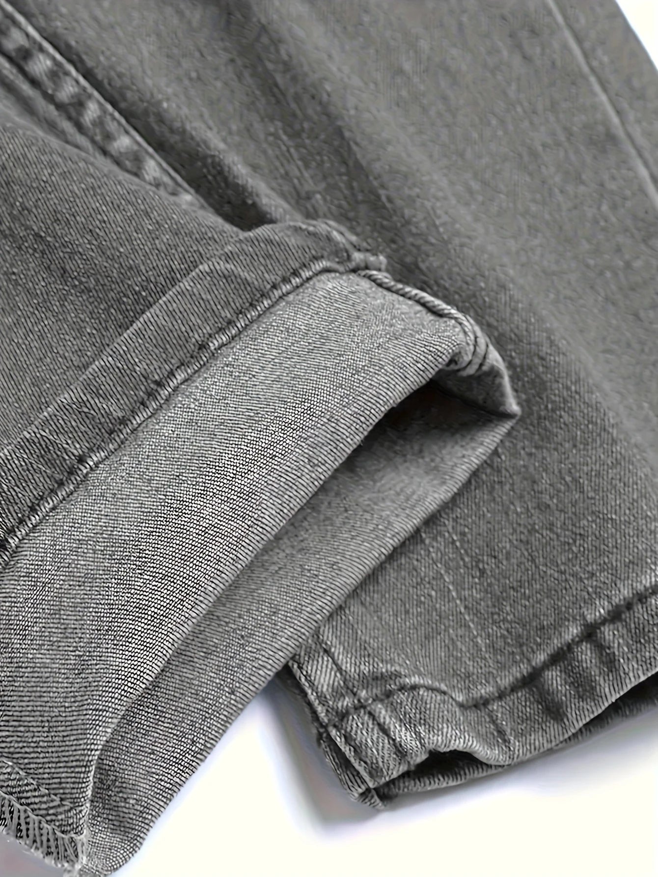 Men's gray skinny jeans with large rips, featuring a unique distressed design that fits the body shape perfectly, making it easy